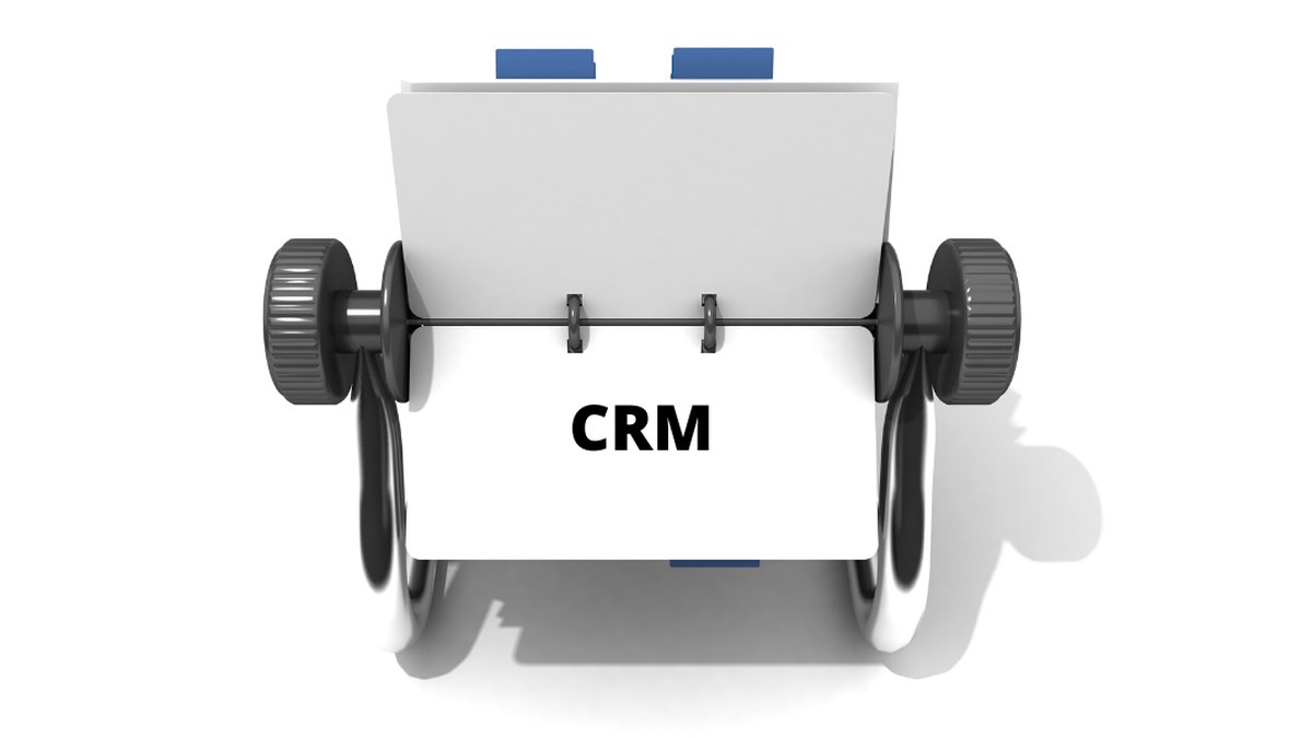 Paper feed on a vintage-style printer with 'CRM' printed, symbolizing CRM software or data flow across a system.