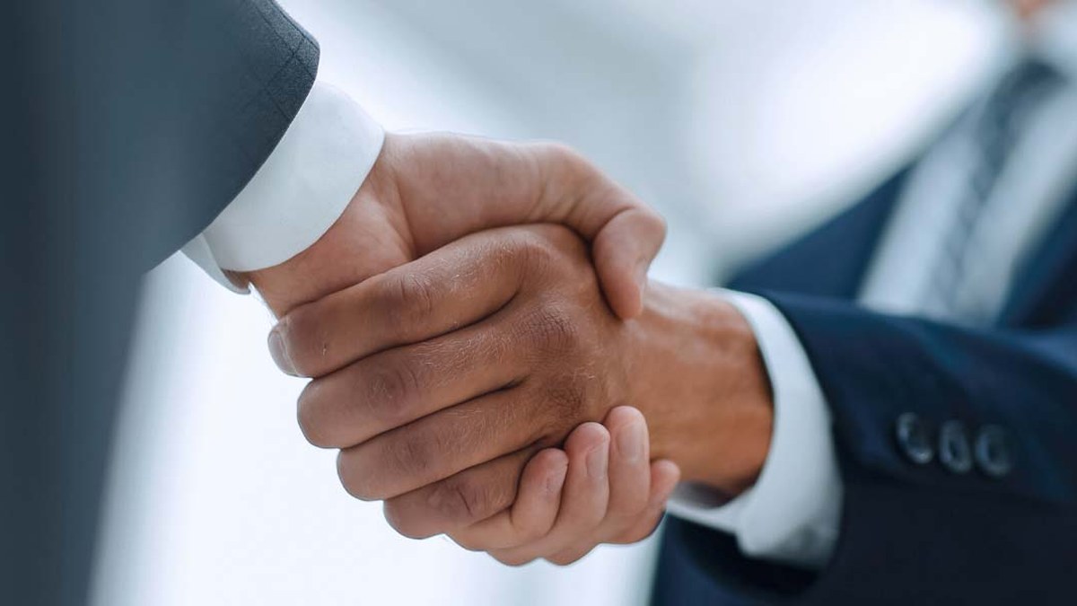 Handshake between two businesspeople symbolizing an agreement or partnership